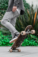 skateboarder jumping on a wood skateboard shoes