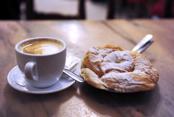 Coffee break -  cup of creamy coffee with delicious pastry. Sweet lifestyle. Breakfast in style.