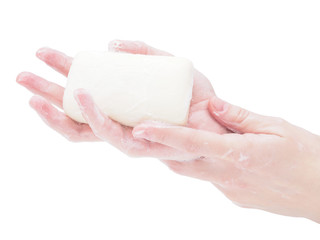 Soap hands holding a bar of soap, close-up, isolate on a white background. Mockup, a place for your label. Ways to protect against the virus and coronavirus in a pandemic