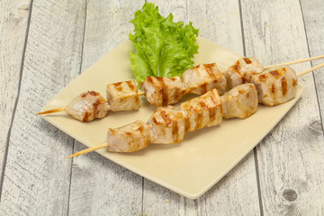 Grilled pork skewer served salad