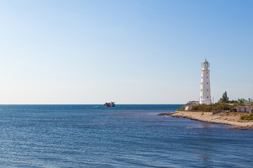 Fototapeta na wymiar Panoramic view of the old lighthouse on a bright Sunny day. Cape Tarkhankut, Black sea, Republic of Crimea.
