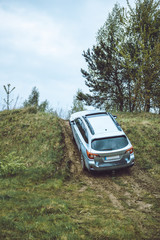 Fototapeta premium suv car travel concept by dirty road
