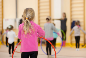 Children's sports and health center. A group of little girls are engaged in gymnastics. © evgeny