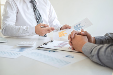 Two business partner team meeting and discussion financial project of investment ideas, presentation and analyzing marketing planning strategy of business making to growth profit and successful