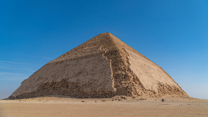 The Bent Pyramid is an ancient Egyptian pyramid located at the royal necropolis of Dahshur,...
