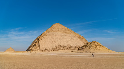The Bent Pyramid is an ancient Egyptian pyramid located at the royal necropolis of Dahshur,...