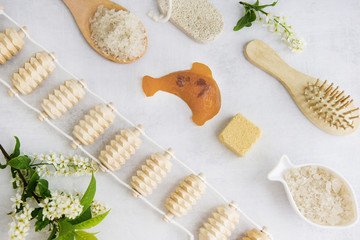 Concept of Spa-cosmetic and cosmetic procedures. Spa-sea salt, wooden comb, massager, handmade...