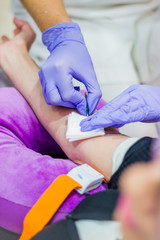 Woman doing blood test in a hospital