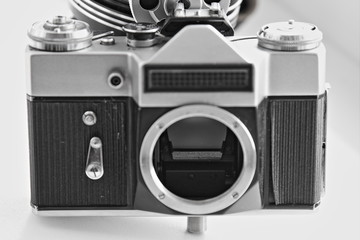 Old film SLR photocamera body with screw bayonet and light meter sensor close up, retro photo...