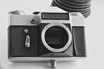 Vintage SLR film camera body with light meter sensor and timer shutter mechanism close up front...