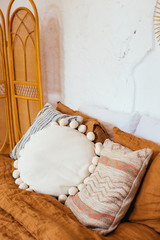 Obraz na płótnie Canvas boho rustic scandinavian bedroom interior. cozy minimalistic design ideas