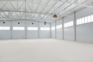 Empty industrial room. Light. Hangar. Plant. Factory.