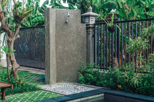 Summer Outdoor Shower In The Backyard With Green Grass