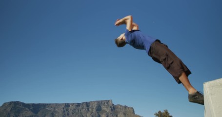Caucasian man practicing parkour - Powered by Adobe