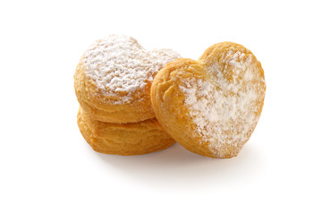 heart shaped shortbread cookies with icing sugar on white background