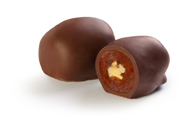 chocolate candies stuffed with dried apricots, prunes, figs and nuts, on a white background, chocolate figs, dried apricots in chocolate, chocolate prunes