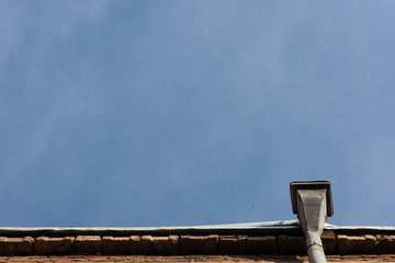 Background from the roof of the building with funnel downspout
