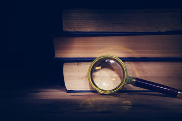 magnifier and books on the table