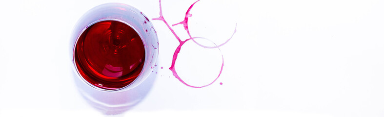 A glass of pink red wine on white background with Traces of wine. Top view. Free copy space.  Concept of organic drinks.
