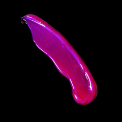 Creative concept fashion flatlay photo of cosmetics swatches beauty products lipgloss on black background.