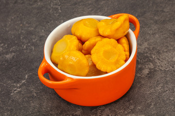 Marinated yellow patisson in the bowl