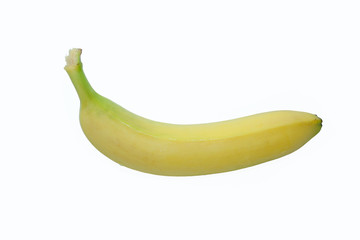 One ripe yellow banana on a white background, isolated.