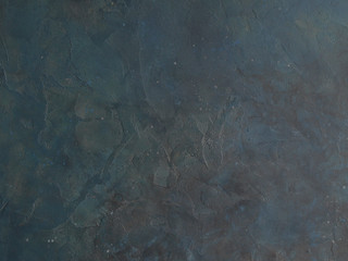 Abstract Grunge Decorative Dark Blue Grey stucco Wall Background. Gloomy Rough Smear Texture. Web Banner or Wallpaper With Copy Space For Design.