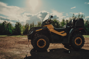 Yellow atv, quad in forest