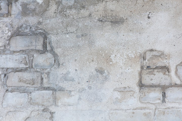 Wall with silicate brick aged with crashed plaster