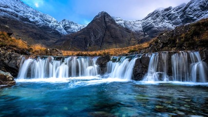Obraz premium Fairy Pools waterfall on the dramatic Isle Of Skye in scenic Scotland, a fantastic adventure travel destination for a holiday vacation to view awesome picturesque scenery