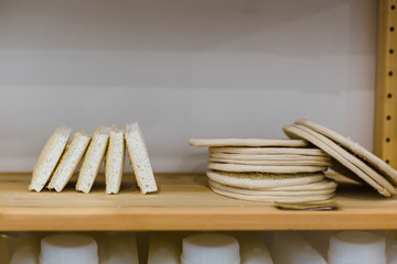 Reusable washable biodegradable kitchen dish sponges on shelves of zero waste shop
