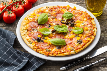 Tasty salami pizza.