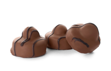 Obraz na płótnie Canvas Delicious milk chocolate candies isolated on white