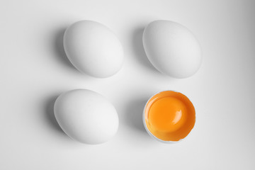 Fresh raw chicken eggs on white background, flat lay
