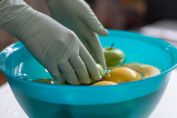 Washing fruits in a bowl