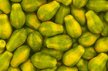 Background from papayas, top view. 3D rendering
