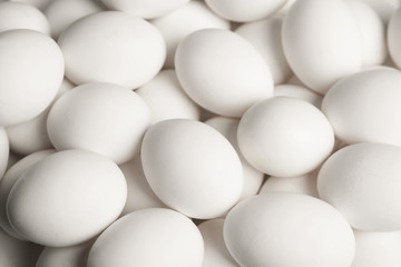 Fresh raw white chicken eggs as background, above view