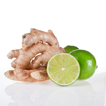 Lime and ginger root isolated on a white background.