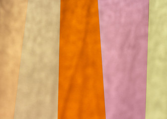 Color papers geometric abstract background with yellow pink and oranges tones with soft shadows.