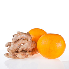 Orange and ginger root isolated on a white background.