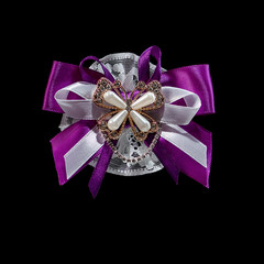 Purple ribbon with brilliants isolated on black background