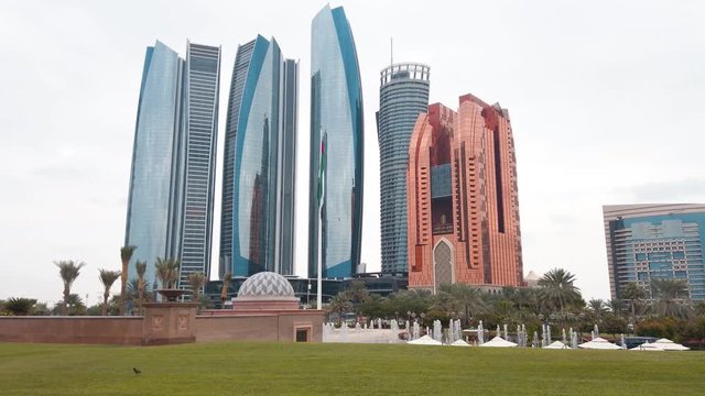 Abu Dhabi downtown with Etihad tower skyscrapers rising high in the United Arab Emirates capital travel and leisure location