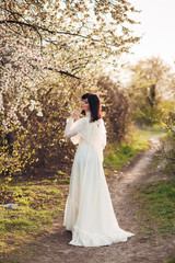 woman in white spring blossoms