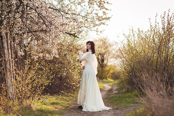 
girl next to a flowering tree