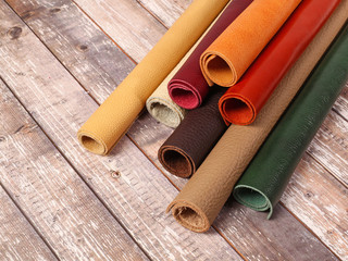 Rolled up multicolored natural leather textures samples