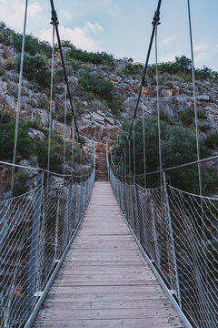 Suspension bridge in the route of the calderones, chulilla, valencia. Hanging bridge.Spanish mountains.