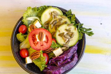 Green salad with sweet tomato, bright colors for fit people and who eat nutritious