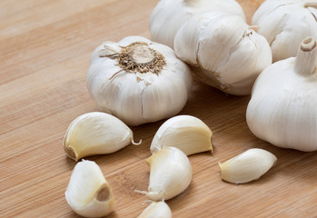 Fresh garlic on wood background