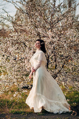 girl near a flowering spring tree