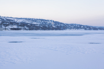 Fototapeta na wymiar winter scenery with village and frozen lake